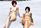 Two hot reheaded twins in tight bikinis sunbathing